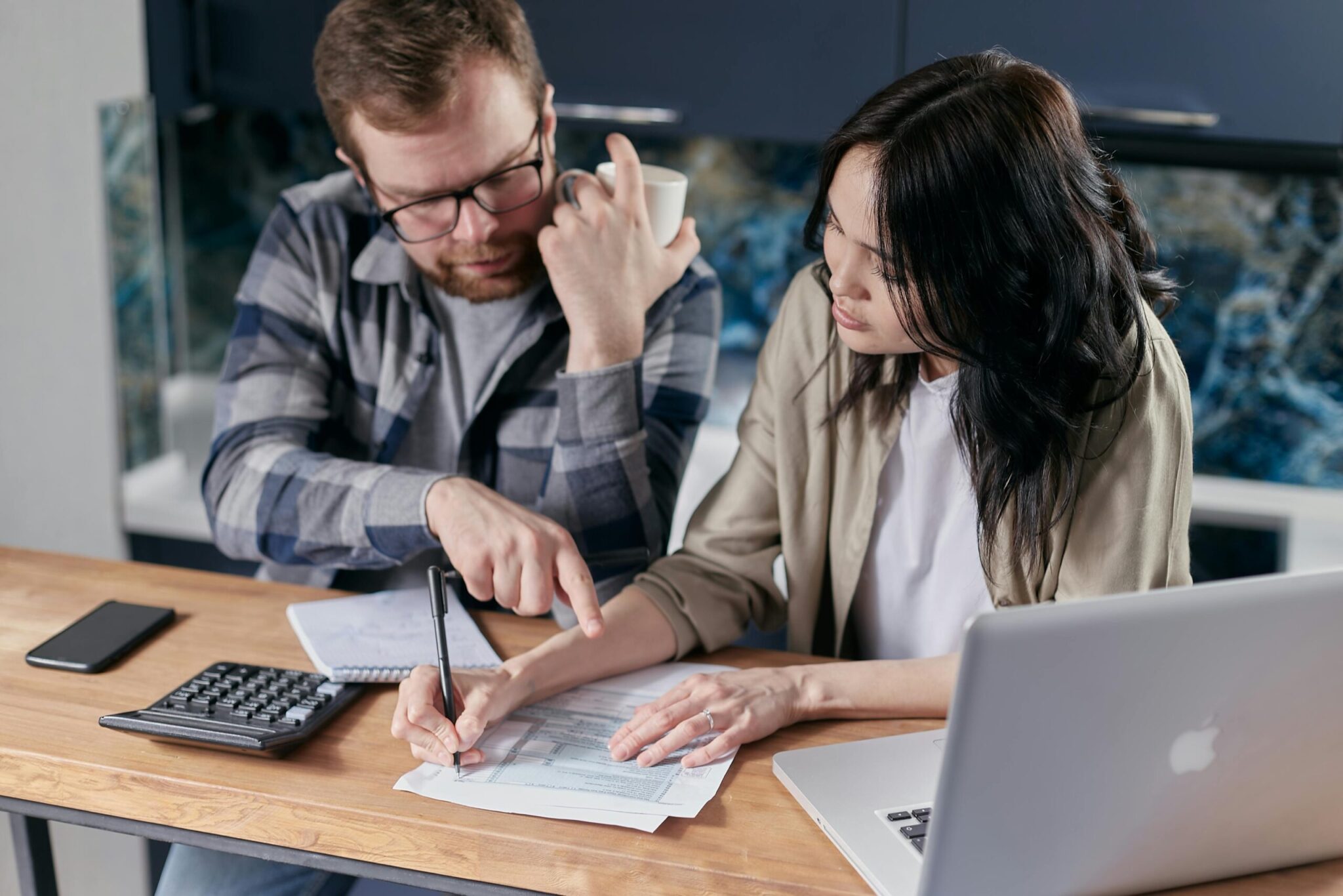 8-Strategies-for-Tackling-Technical-Debt-at-Your-Company-scaledjpg | ALCON DTS: Austin Best Managed IT Support Services Free couple calculating al their bills stock photo