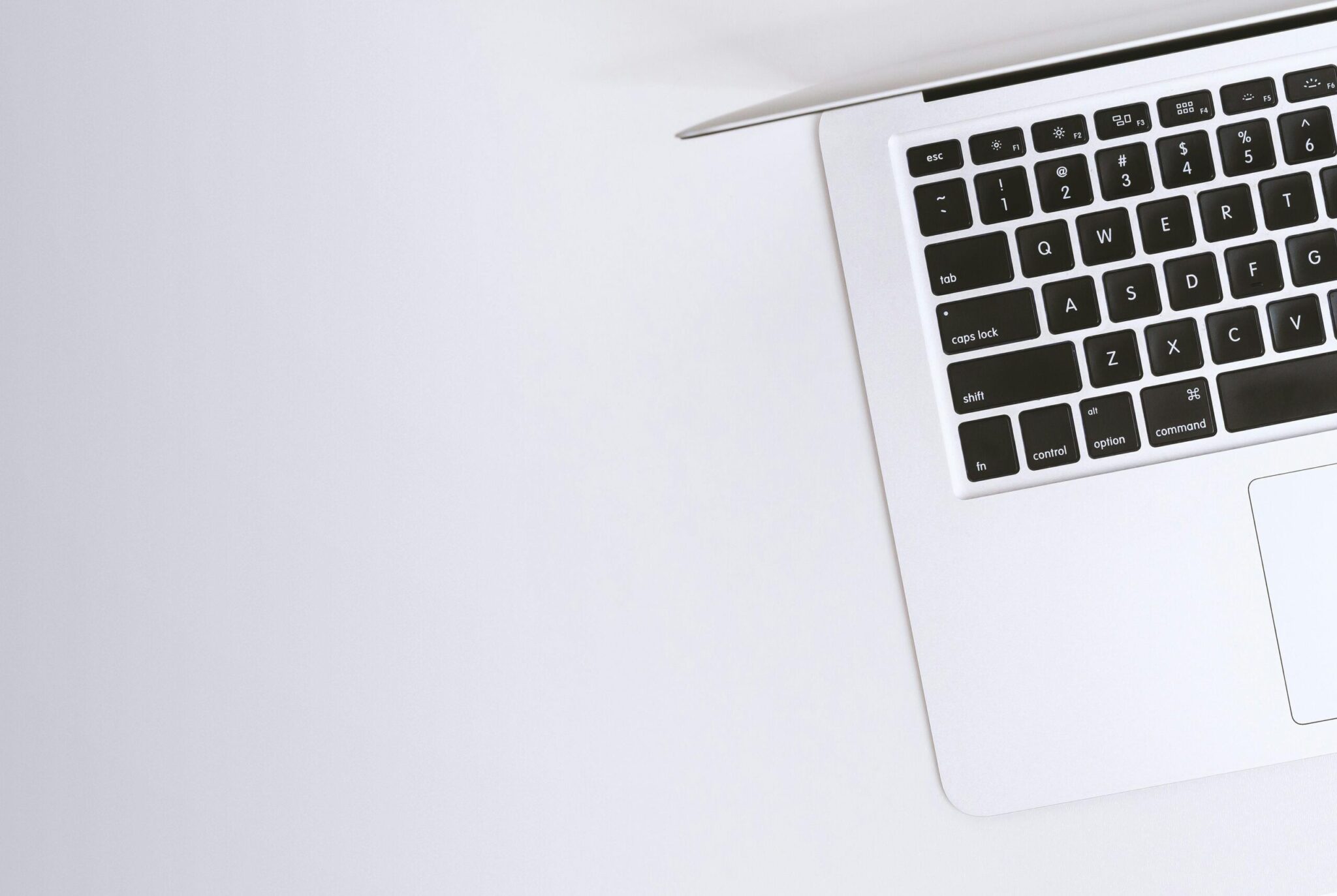 Is-It-Time-For-a-Device-Upgrade_-Check-For-These-7-Signs-scaledjpg | ALCON DTS: Austin Best Managed IT Support Services Free Aerial view of a sleek laptop keyboard on a clean, white surface, ideal for tech backgrounds. Stock Photo