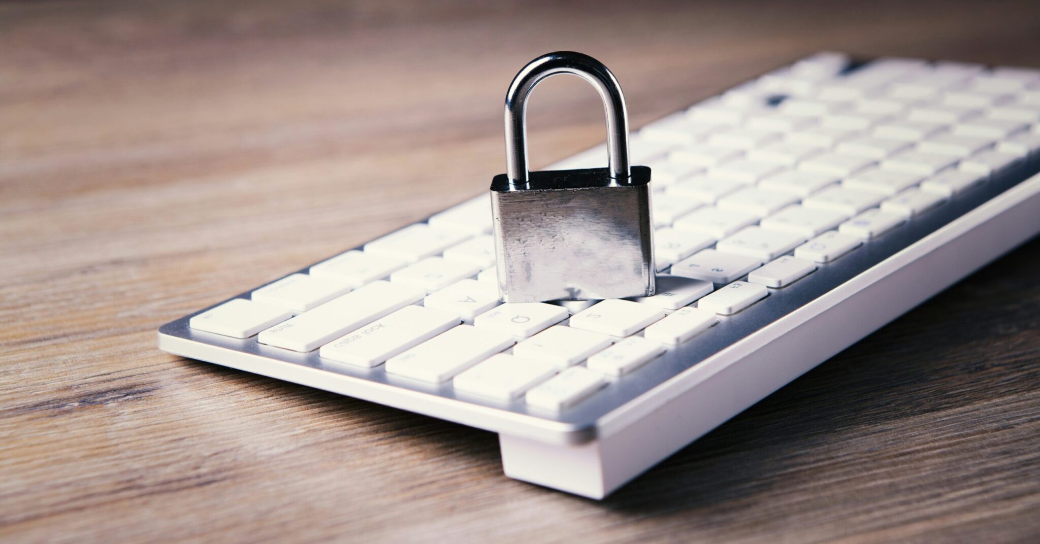 Remote-Work-Security-Revisited_-Advanced-Strategies-for-Protecting-Your-Business-in-2025-scaledjpg | ALCON DTS: Austin Best Managed IT Support Services a computer keyboard with a padlock on top of it